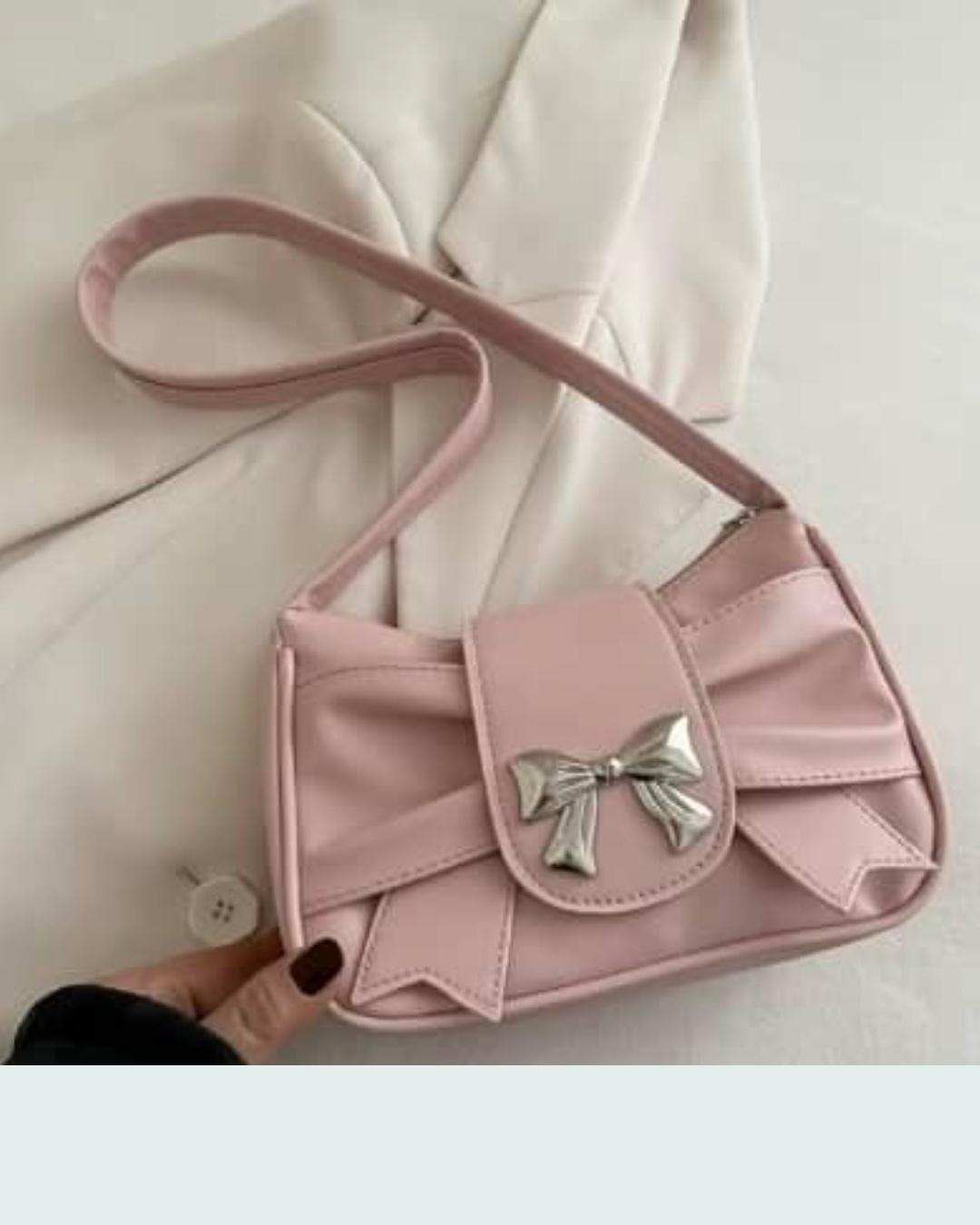 Cartera rosada con lazo plateado · cartera rosada con lazo